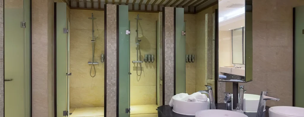 Row of shower cubicles in a commercial change room